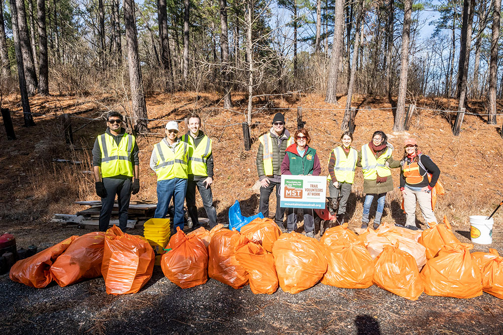 On a cold January morning, volunteers with Friends of the Mountains-to-Sea Trail and Keep Durham Beautiful work to keep the trail around Falls Lake clean.