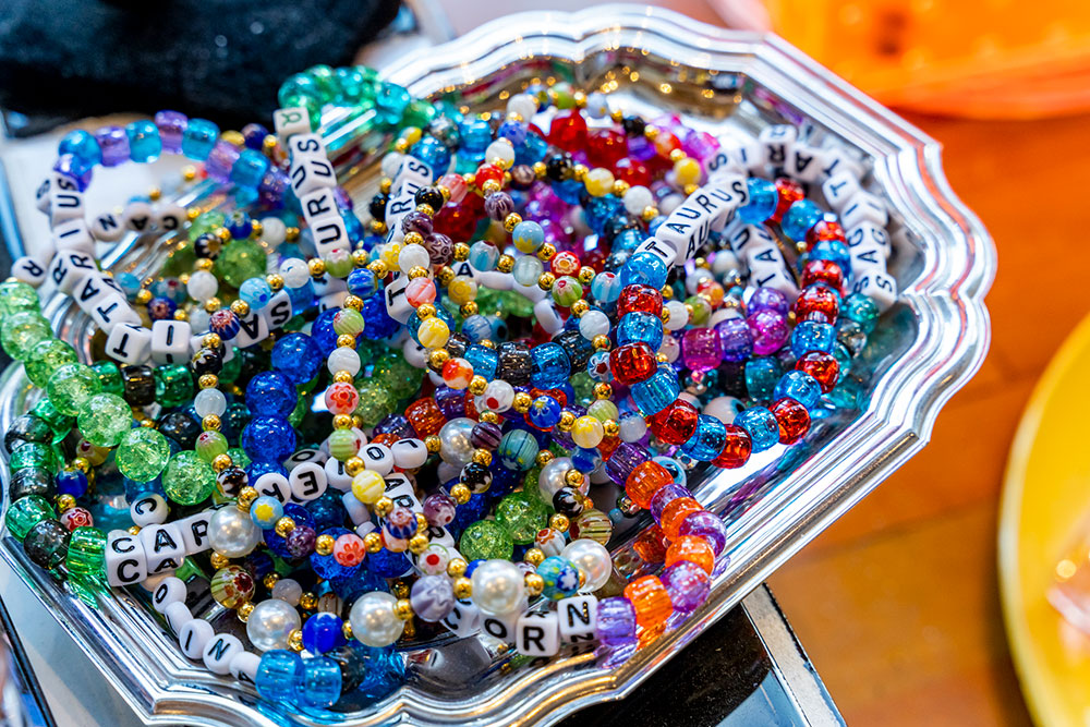 Blast from the past! Letter bead bracelets, notoriously popular in the 90's, are served up on a silver platter.
