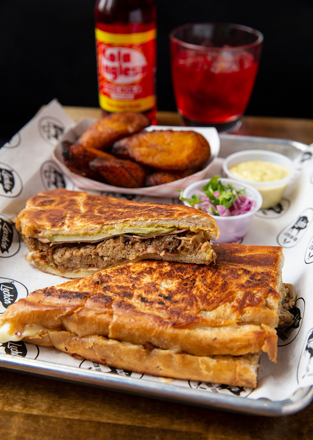 Lechon Latin BBQ’s take on a classic Cuban sandwich features their signature pulled lechon pork and pairs perfectly with a side of plantains.