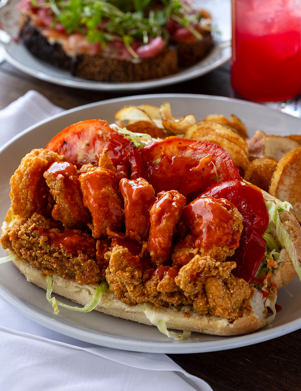 Entrees such as the Peacemaker Po'boy pay homage to chef Speaks' culinary journey from New Orleans.