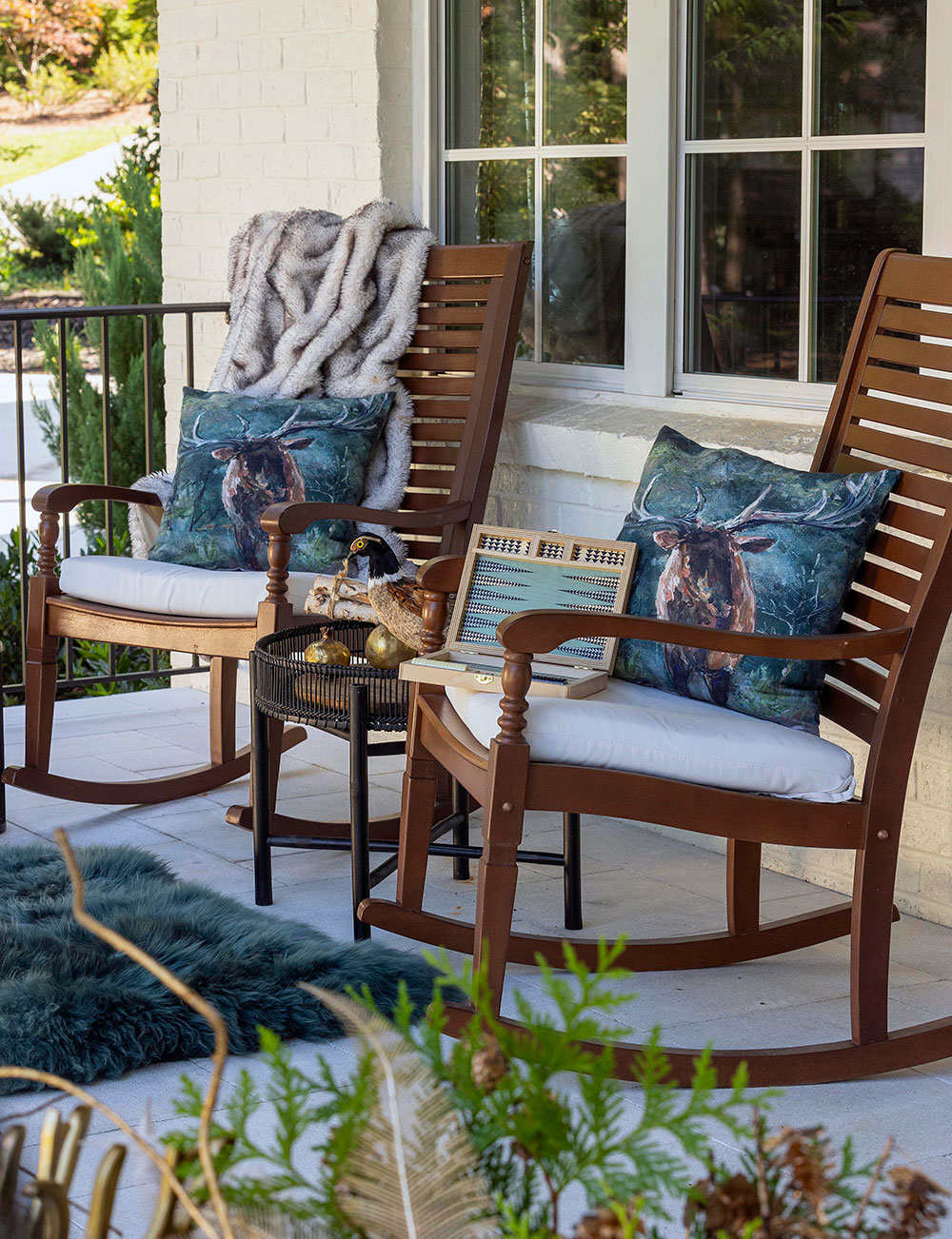 ROCK THE HOLIDAYS: If you appreciate timeless elegance, a Southern-style rocking chair is the perfect evergreen choice for added comfort and style. Adorn them with a snug faux fur throw for a touch of luxury.