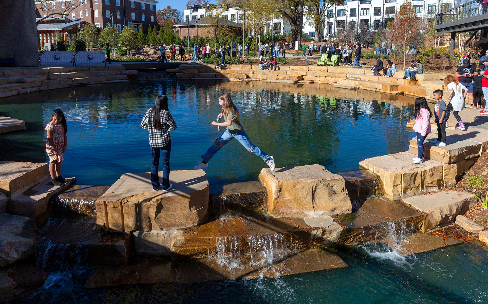 The park's tiered water feature — designed to improve water quality and mitigate flooding downstream — is the perfect place to explore (and jump rocks).